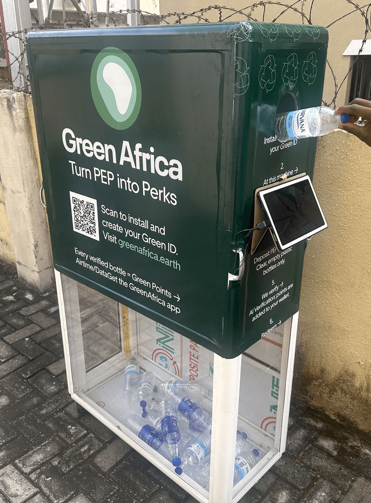 Close up person hand holding glass bottle